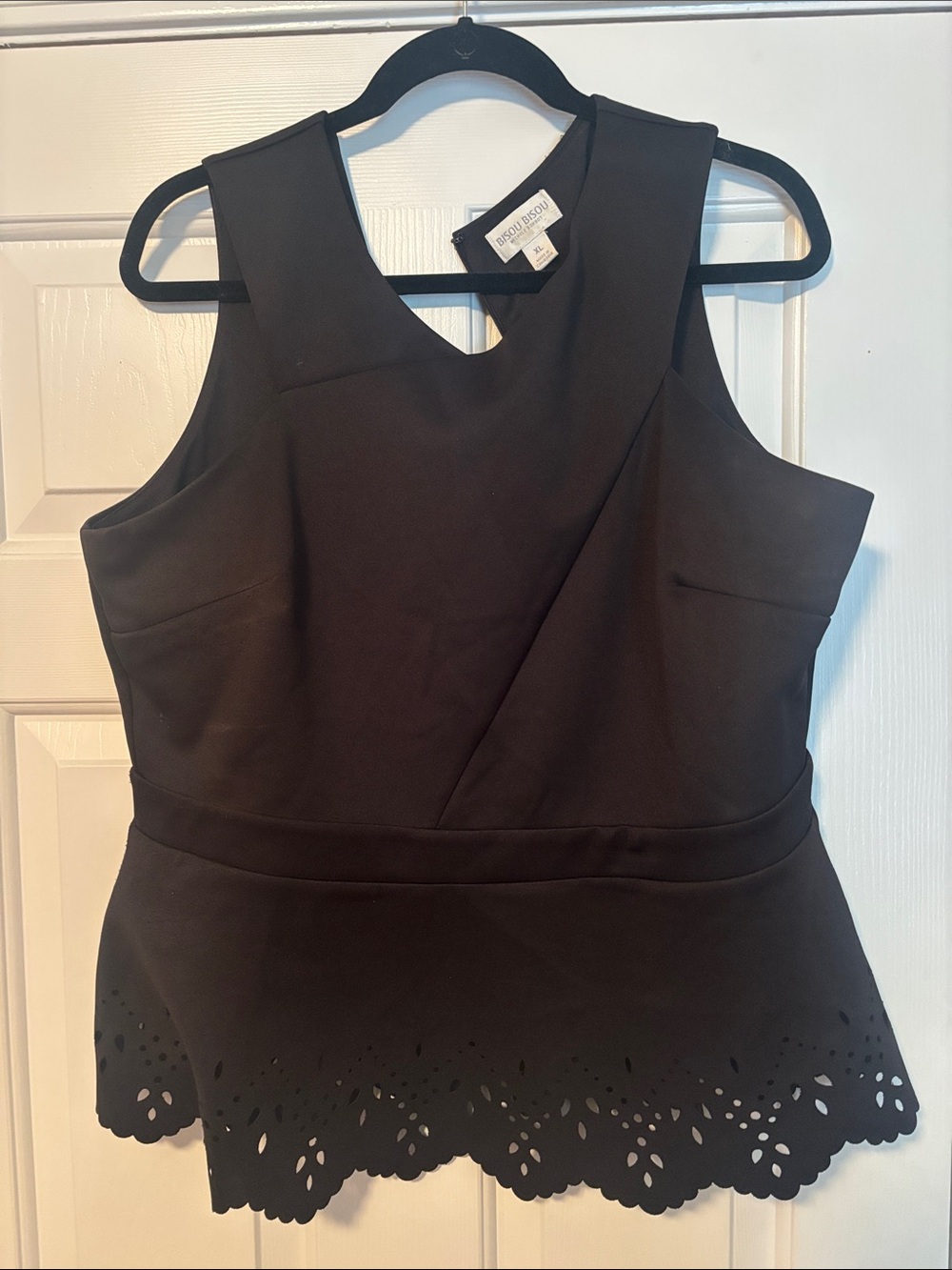 Bisou Bisou Black Sleeveless Peplum Top and skirt. Laser cut design. Gently worn